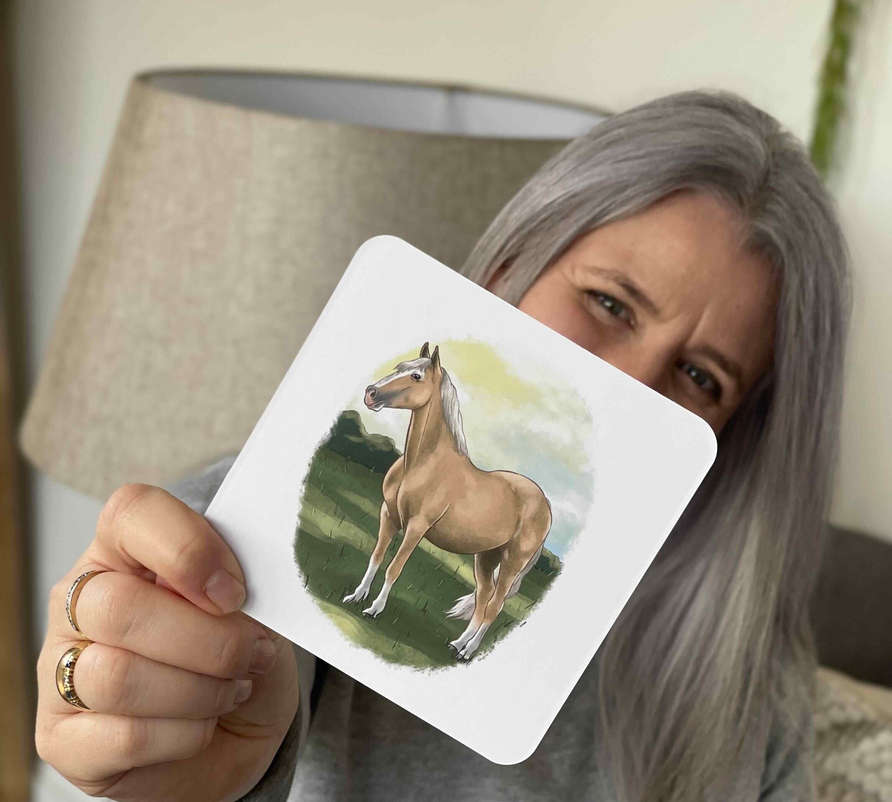 The Phive founder holding horse phonics card.