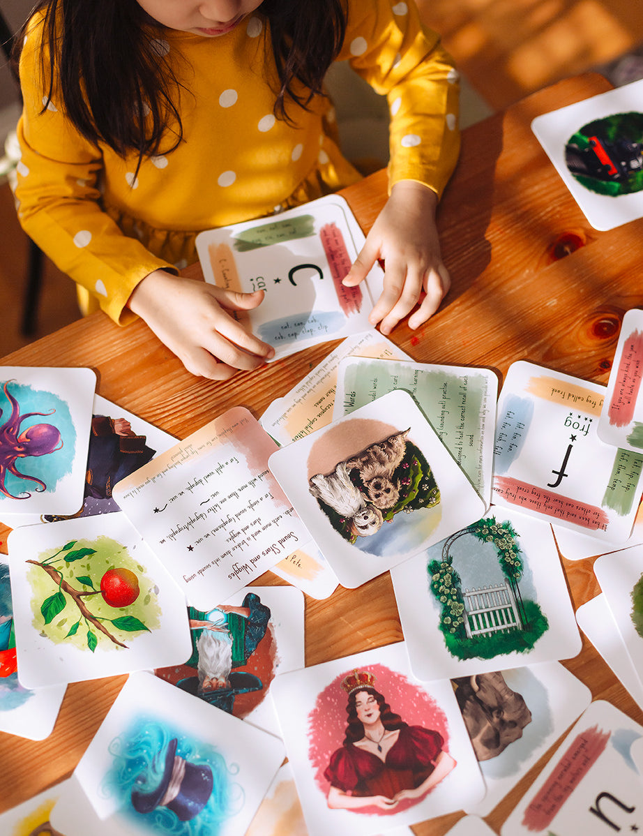 A girl sorting her phonics cards.