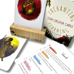Selection of creative writing story cards for kids with card showing a ring in a wooden card stand