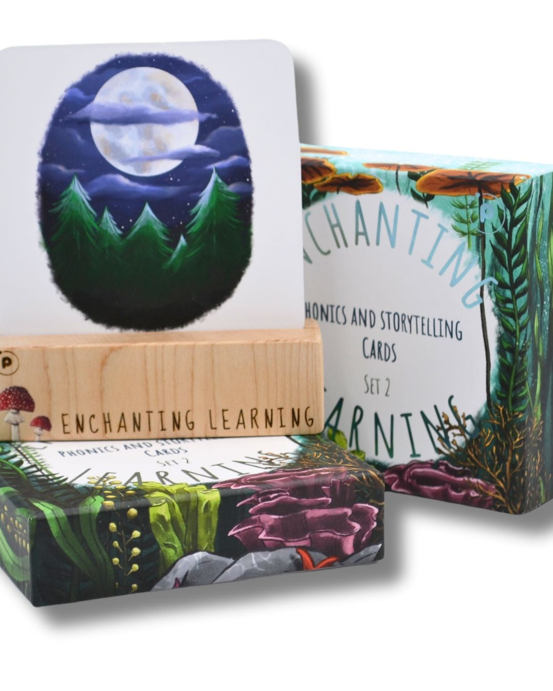 Wooden phonics card stand showing moon phonics card and a set of Enchanting Learning Cards.