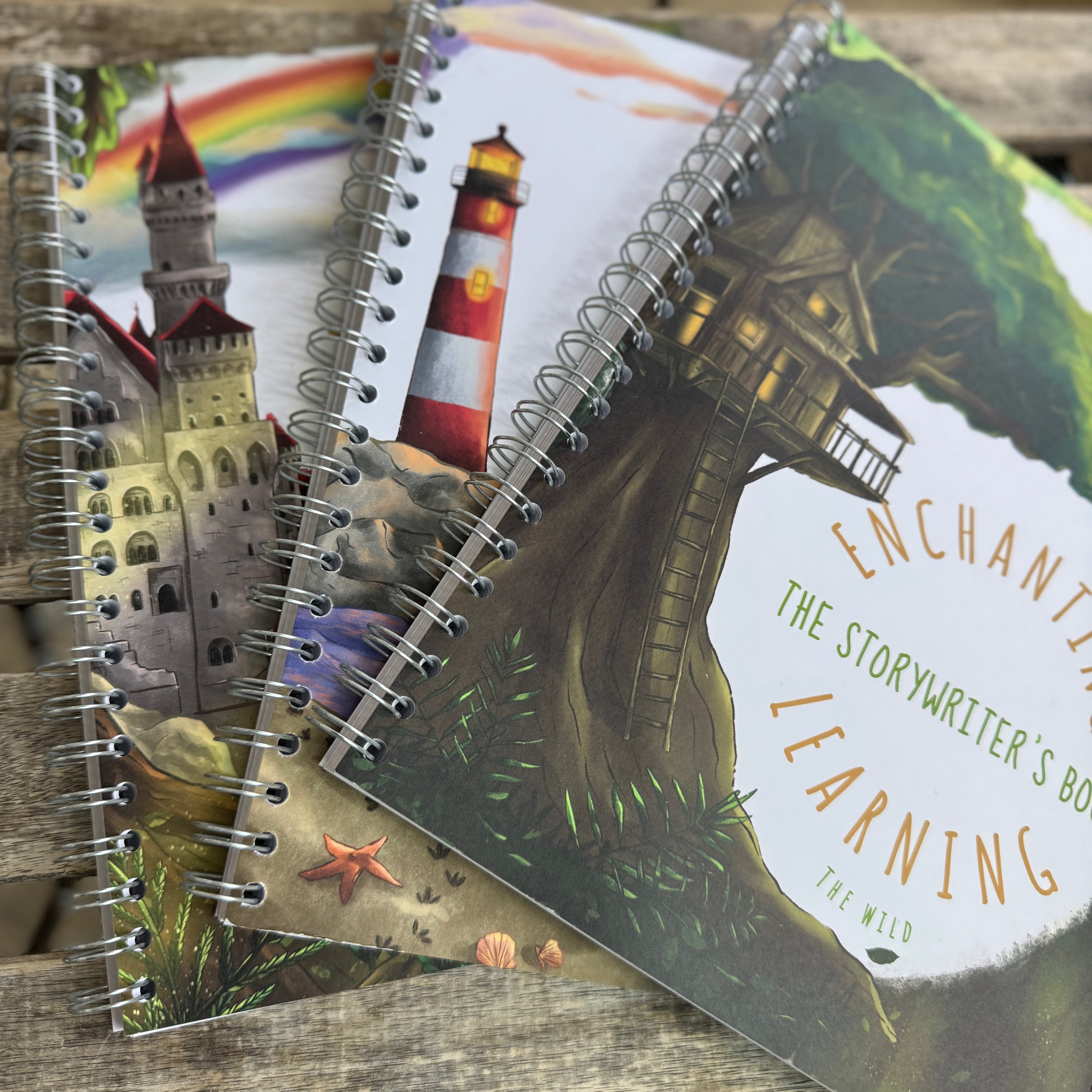 Three writing books displayed on a table. One showing a jungle scene , one showing a lighthouse and one showing a castle.