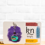 Potion and knight phonics cards on a wooden shelf.