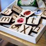 A tray of colourful phonics tiles.