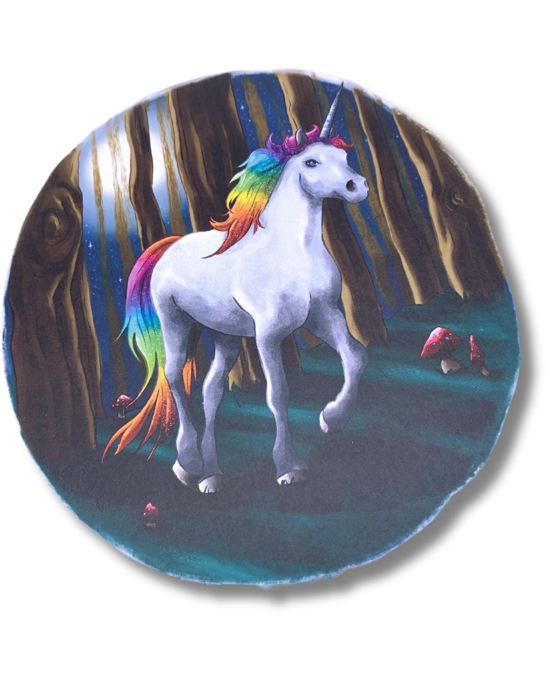 Rainbow unicorn in nightime woodland scene.