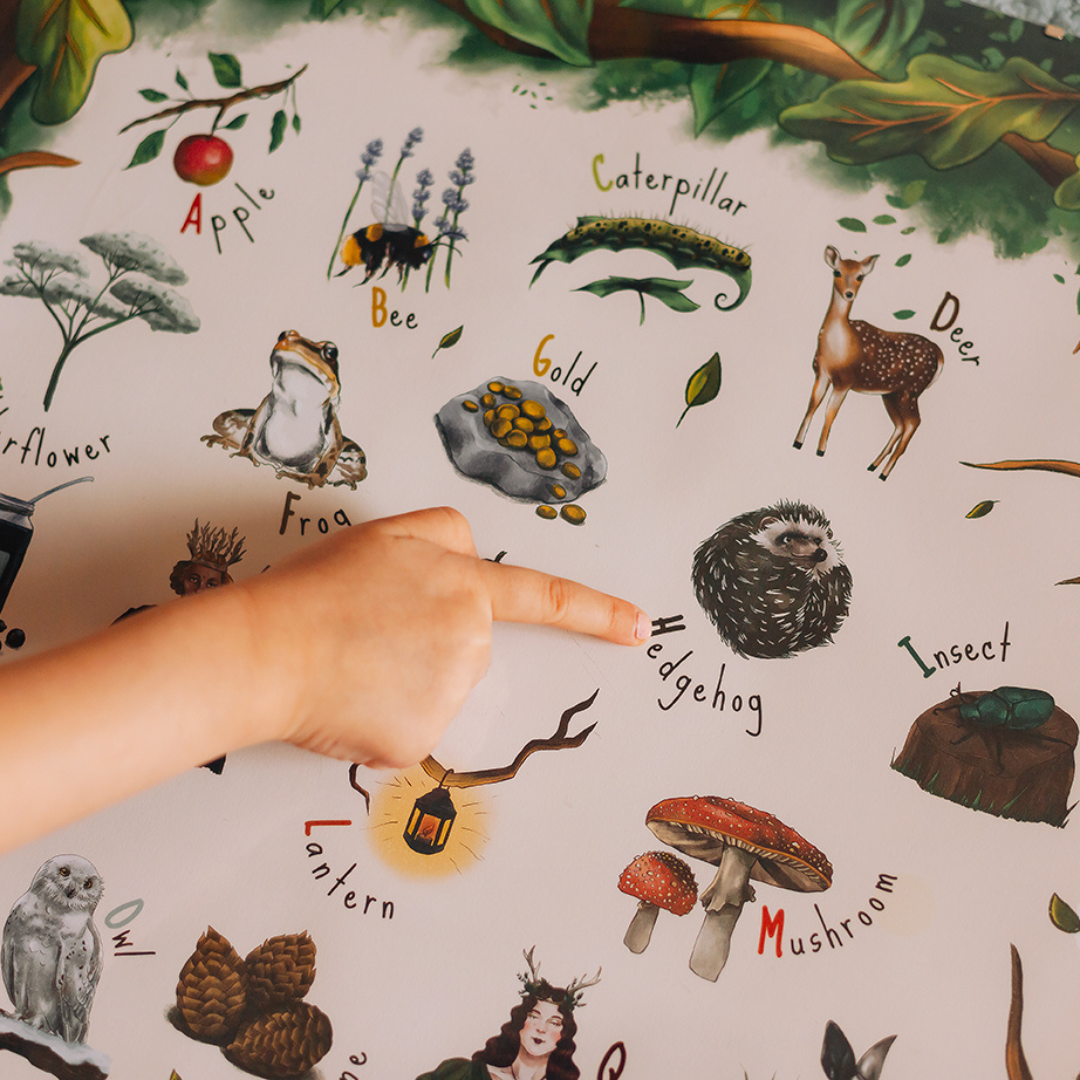 girl pointing to a hedgehog on her woodland power.