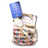 Organic tote bag filled with story creator cards and story writing book.