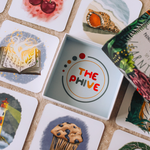 phonics tiles and packaging in a grid on the floor.