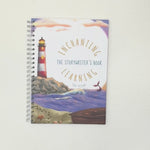 Ocean decorated book and card showing lighthouse and an underwater scene.
