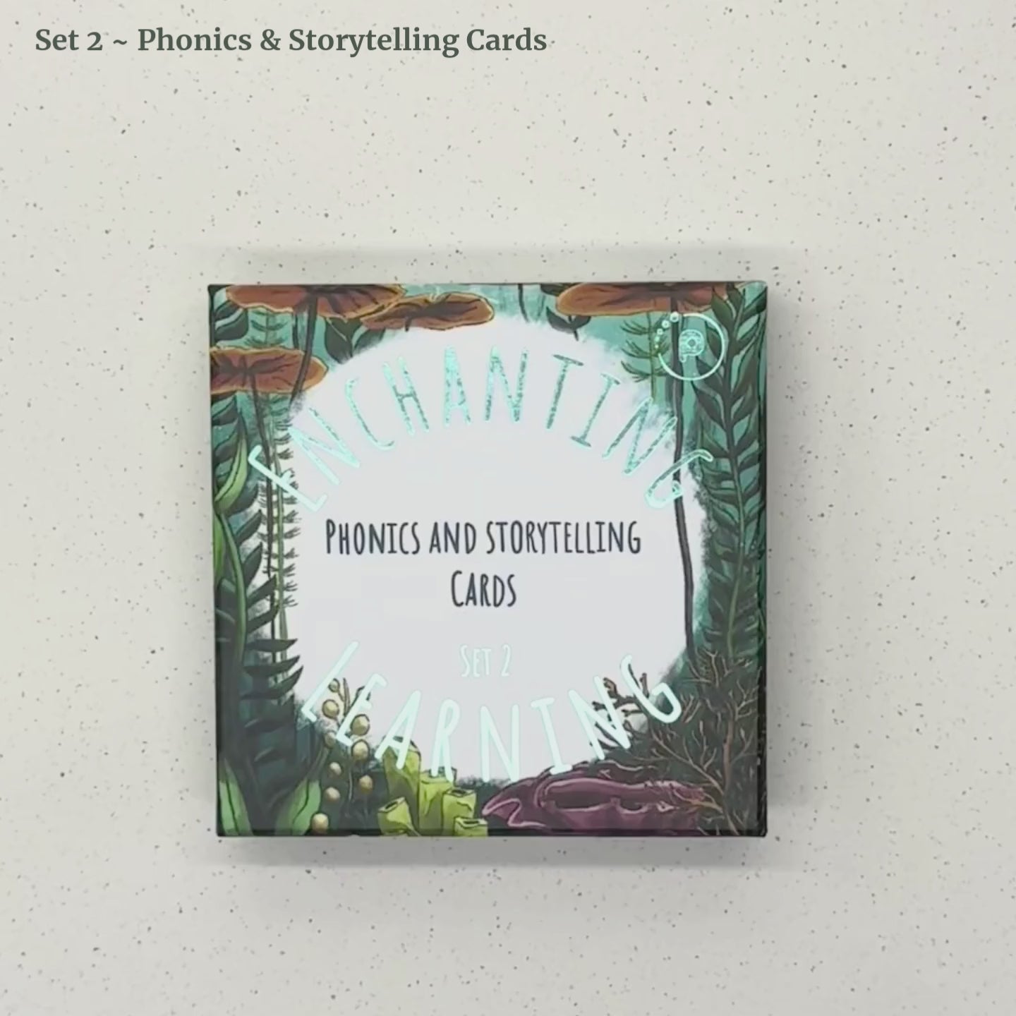 an ocean themed box of phonics and storytelling cards showing the packagibg and the illustratde cards inside the box designed for children.