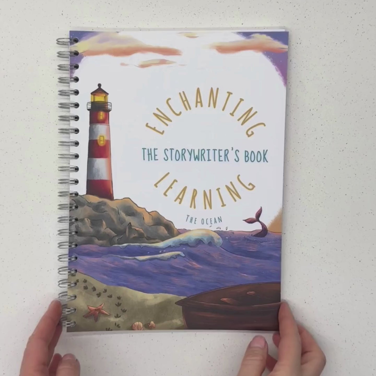 ocean themed book with a lighthouse on the cover and writing, drawing and planning pages inside.