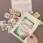 phonic tiles with letters and pictures, a cotton sack for phonics games, a word suggestion card and wooden word building frames.