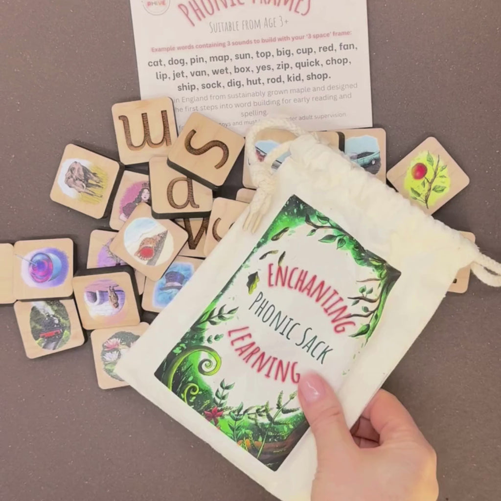 phonic tiles with letters and pictures, a cotton sack for phonics games, a word suggestion card and wooden word building frames.