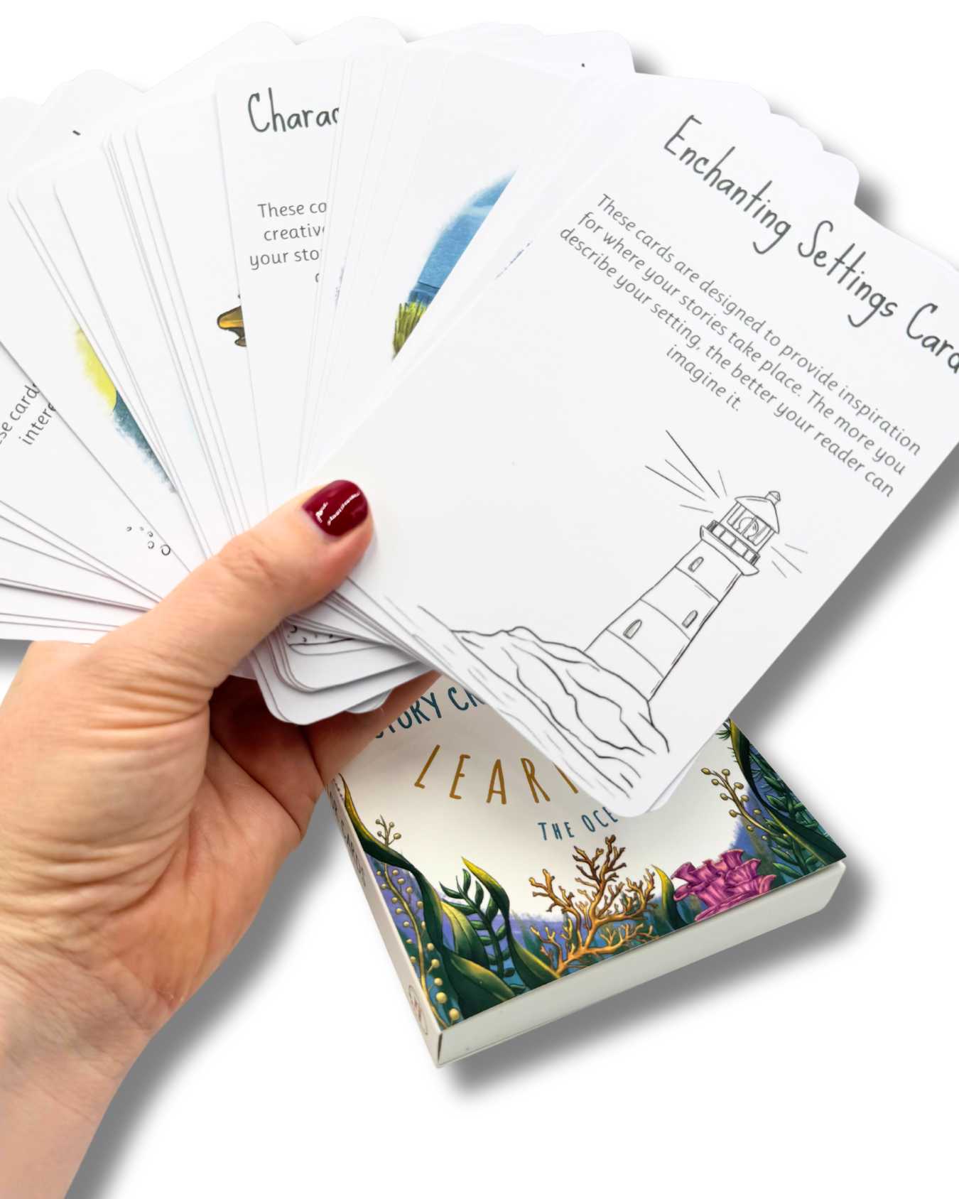 hand holding story creator cards.