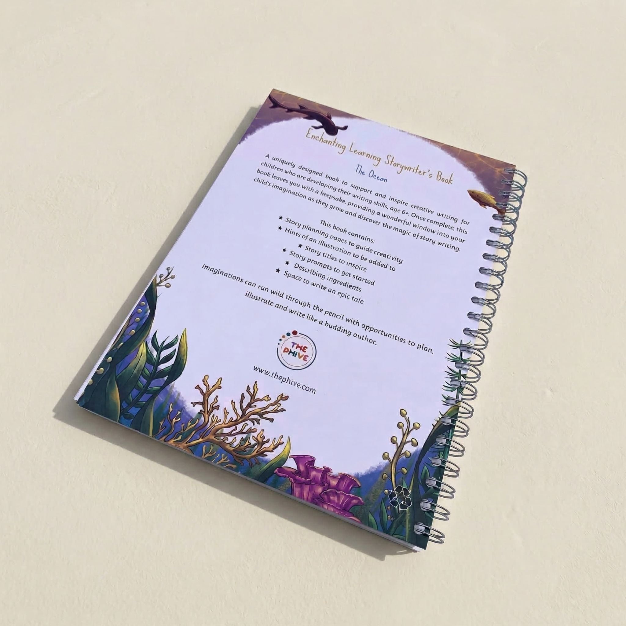 Storywriting book with underwater-themed cover and text on a beige background
