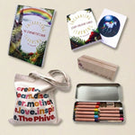 Educational materials including books, a tote bag, and colored pencils on a light background