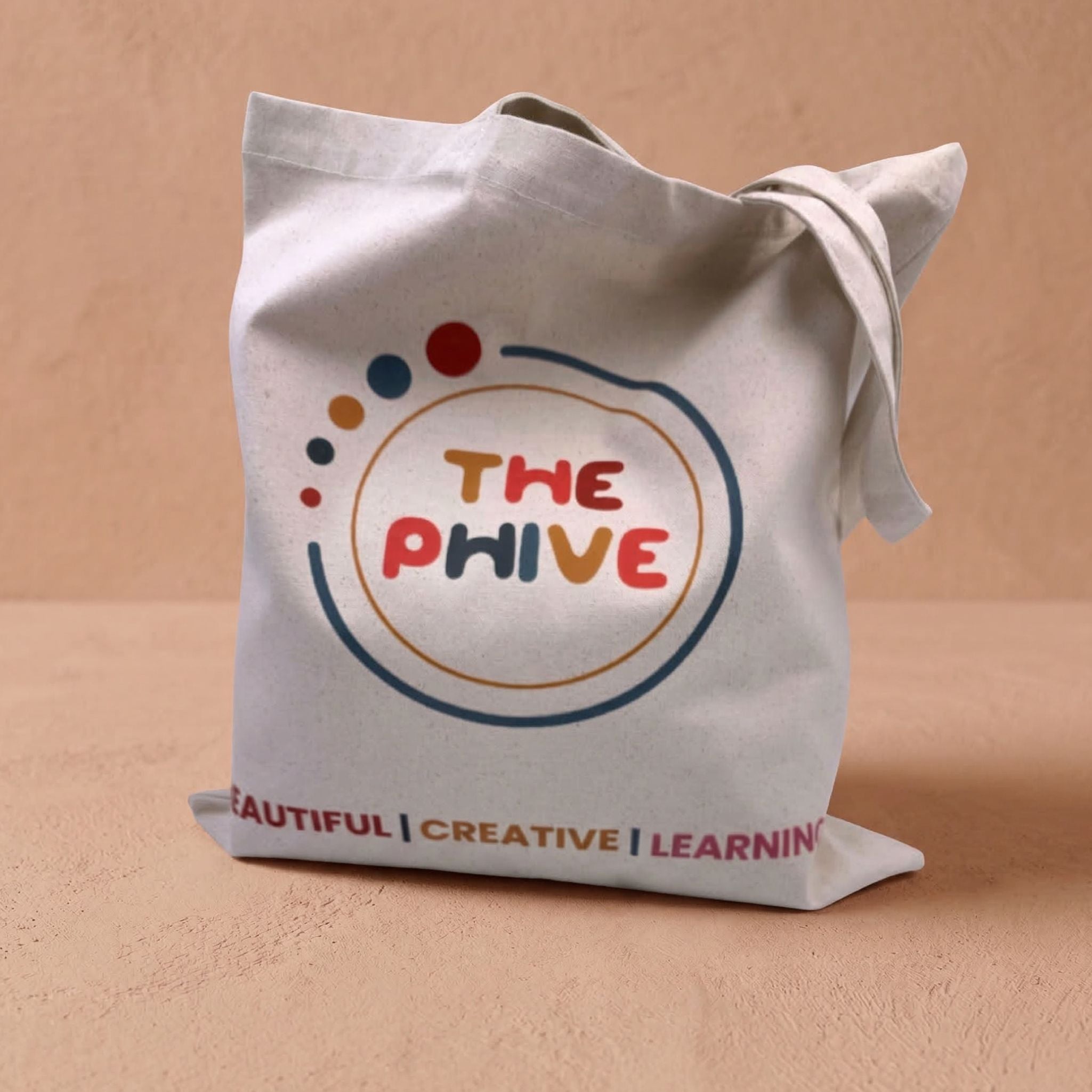 Tote bag with 'The Phive' logo and text on a beige background