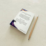 back view of story creator cards, in an ocean theme with a pencil on a light surface
