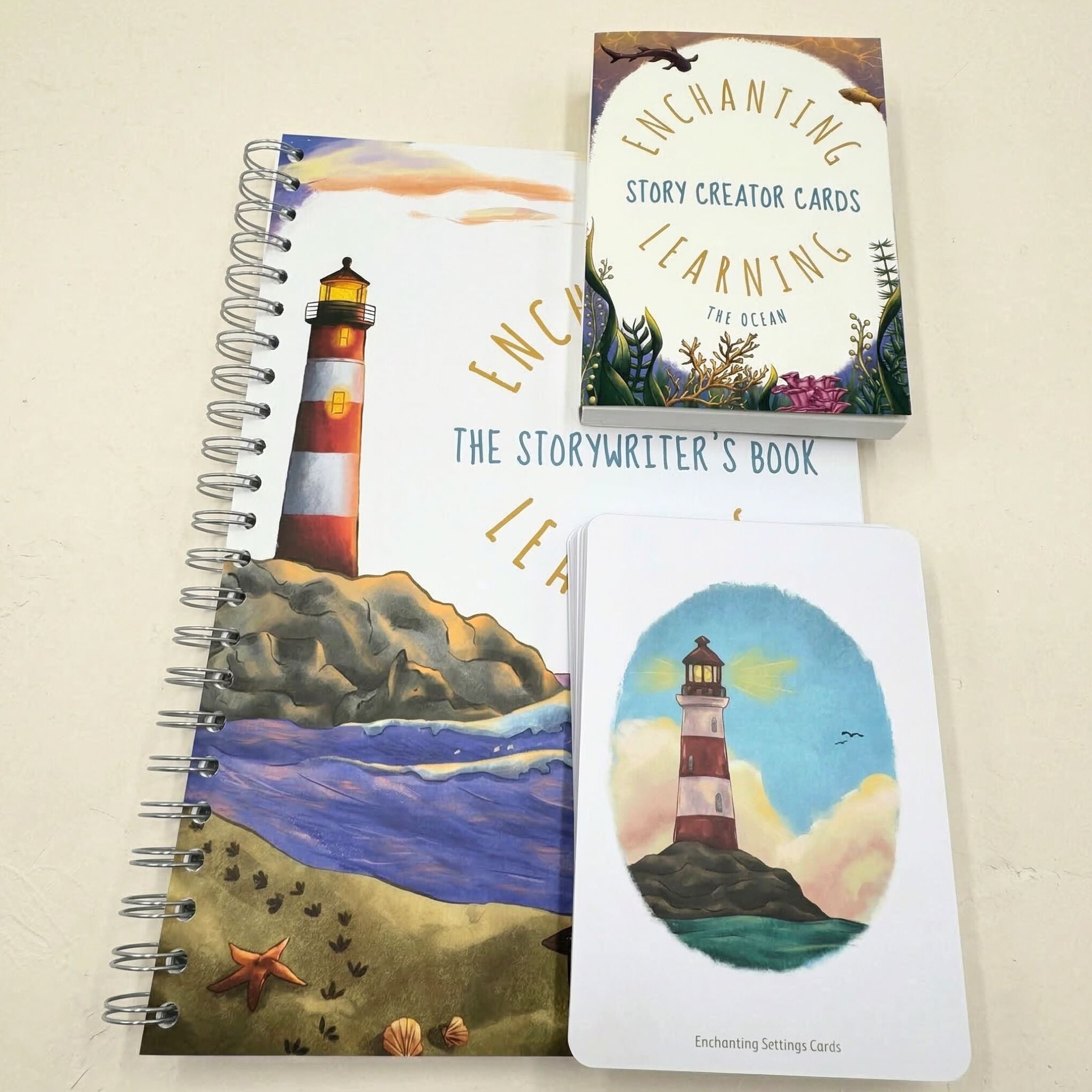 writing book with lighthouse illustration, 'The Storywriter's Book' and 'Enchanting Story Creator Cards' on a beige background