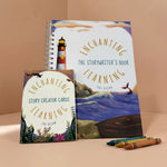 A book titled ' 'The Storywriter's Book' on a beige background with crayons. and a pack of ocean themed writing cards.