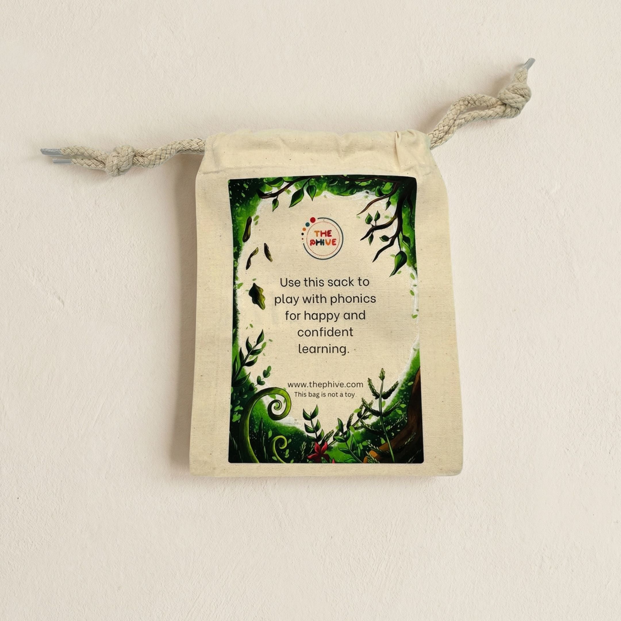 a cotton play sack with a forest print on for phonics play.
