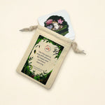 play sack on a cream background with a frog card pocking out.