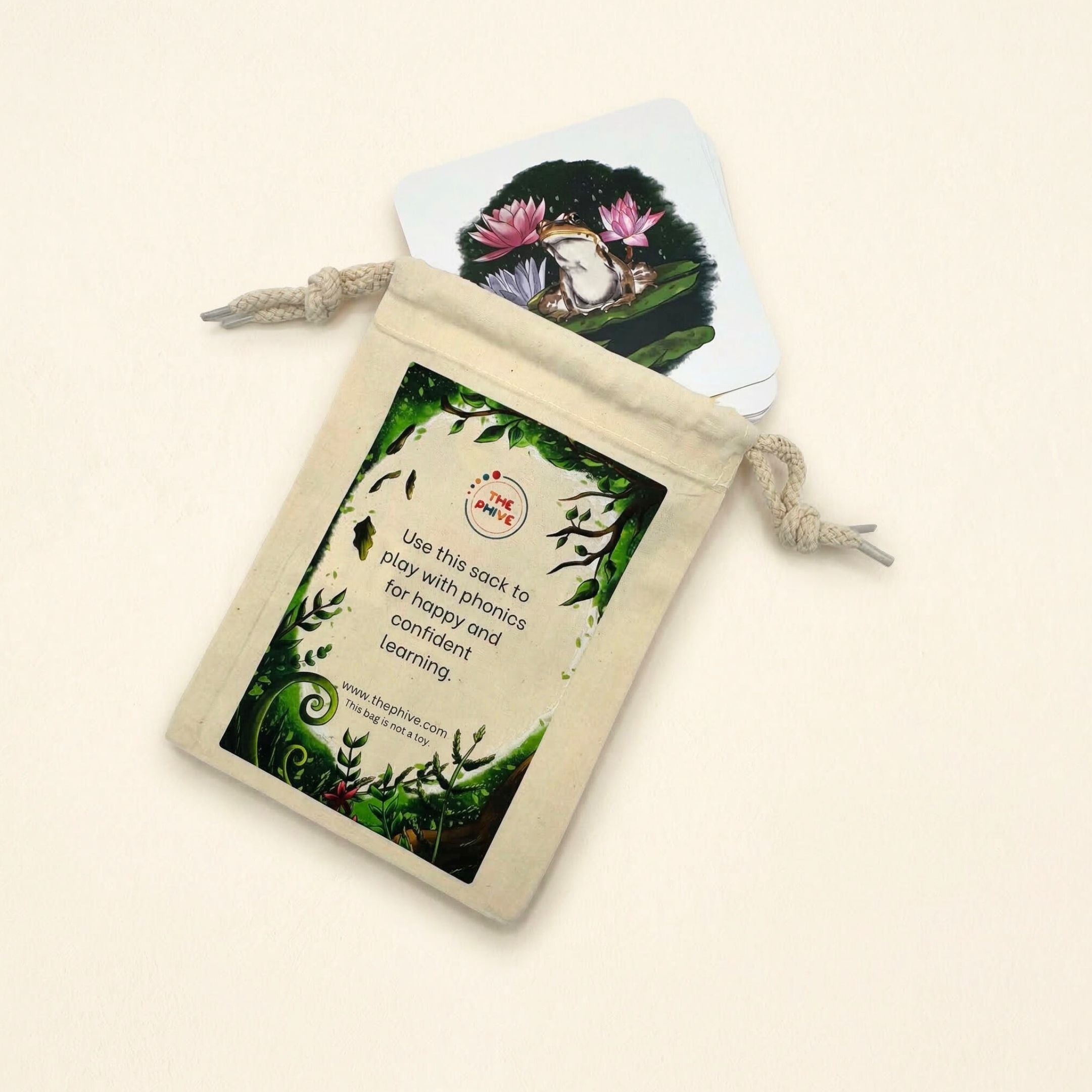 play sack on a cream background with a frog card pocking out.