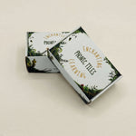 Two boxes of 'Enchanting Learning' phonics tiles on a beige background