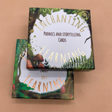 two boxes of 'Enchanting Learning' phonics and storytelling cards on a beige background