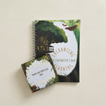 A writing book with a treehouse background with a set of cards for phonics and storytelling with a woodland design.