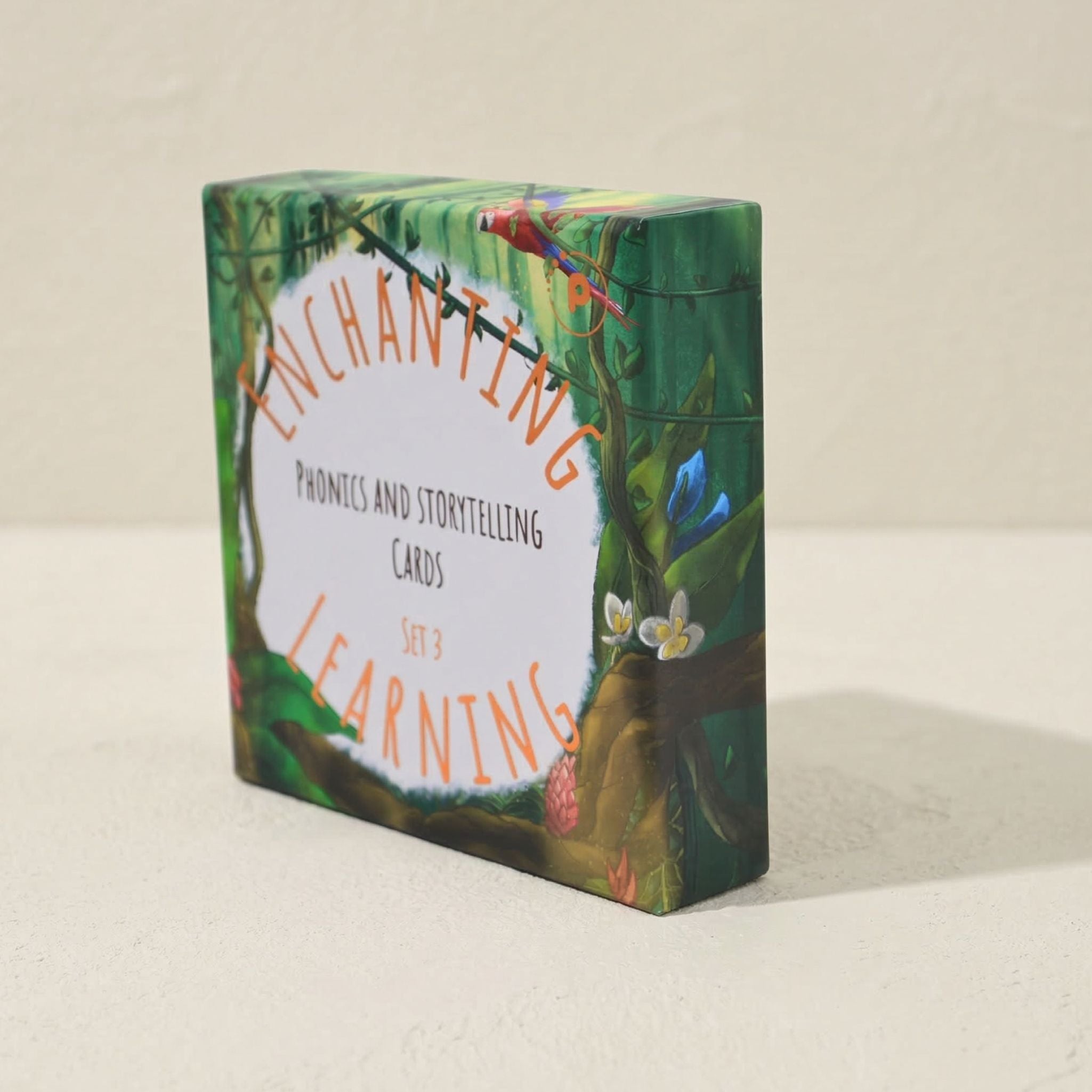 Phonics cards box with 'Enchanting Learning' and jungle-themed design on a beige background