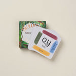 Set of educational phonics cards with colorful designs on a beige background.