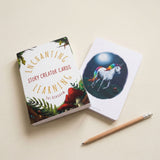 Card with unicorn illustration and 'Enchanting Story Creator Cards' packaging on a beige background