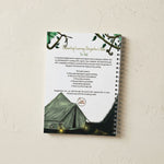 the back cover of a jungle themed writing book for kids laying on a pale background.