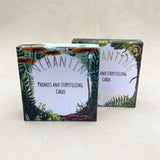 Two boxes of 'Enchanting Learning ' phonics and storytelling cards on a white background