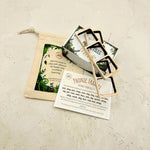 Set of wooden phonetic frames with a leaf-themed pouch and instructions on a textured beige surface