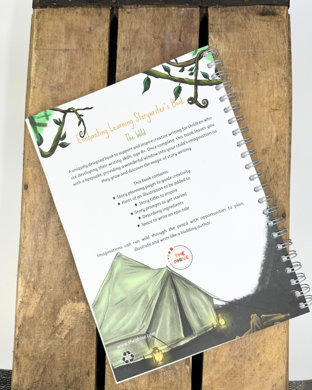 The back cover of The Wild writing book showing a campsite.