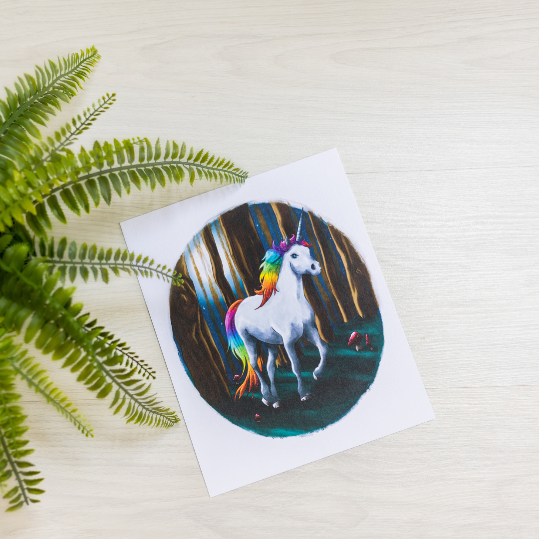 Unicorn illustration on a postcard with green leaves on the side